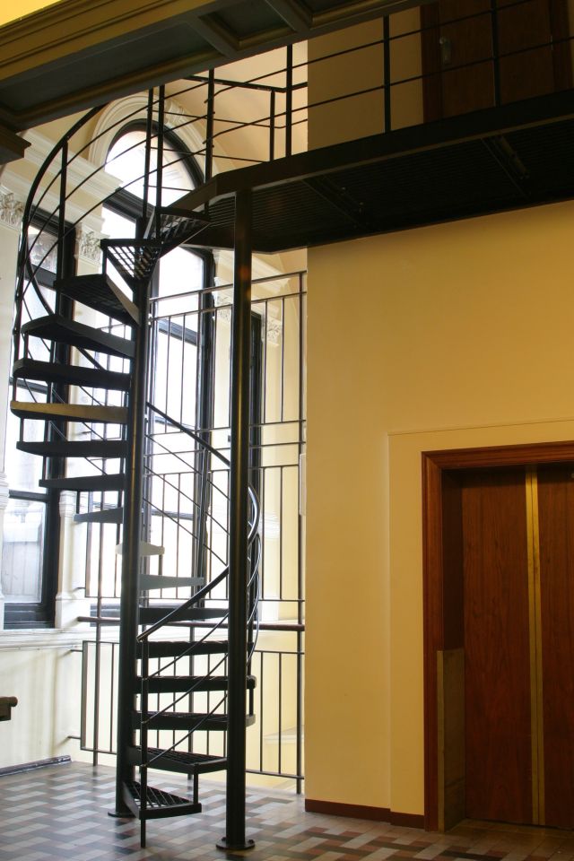 A black,wrought-iron spiral staircase was installed for access to the new motor room.