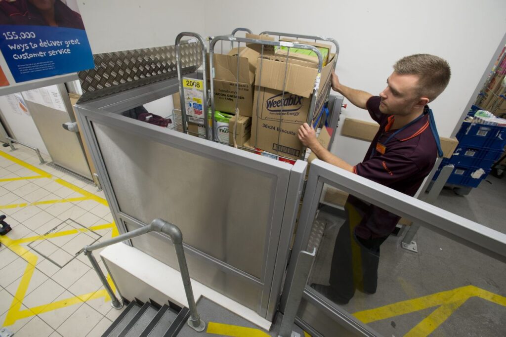 A Stannah Levelmaster helps with negotiating changes in level in a busy supermarket stock room
