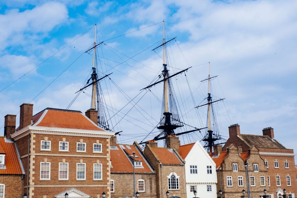 Front facade of The National Museum of the Royal Navy, Hartlepool, with the masts of HMS Trincomalee rising behind