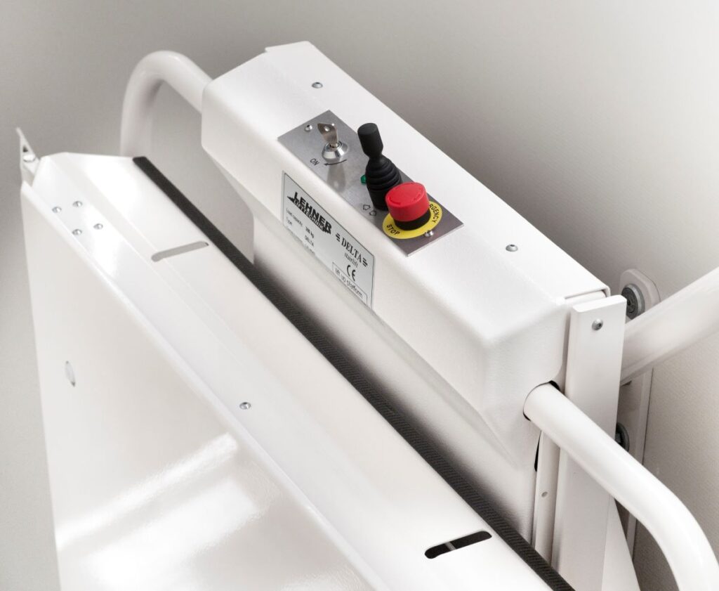 Joystick controls on platform sidewall.