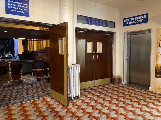 The new Stannah lift features reflective surfaces to add the perception of depth to the floor space of the lift, as well as touches that reflect the glitz and glamour of the Arts and Crafts Movement, such as brass panels and handles.