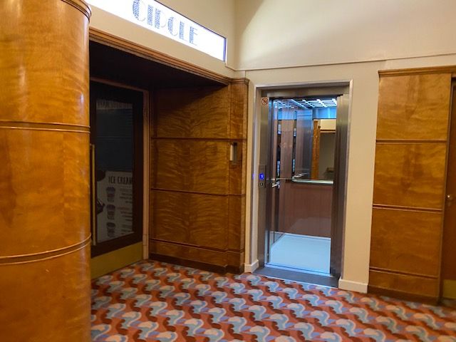 The new Stannah lift features reflective surfaces to add the perception of depth to the floor space of the lift, as well as touches that reflect the glitz and glamour of the Arts and Crafts Movement, such as brass panels and handles.