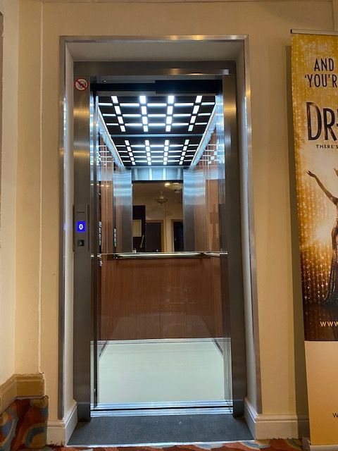 The new Stannah lift features reflective surfaces to add the perception of depth to the floor space of the lift, as well as touches that reflect the glitz and glamour of the Arts and Crafts Movement, such as brass panels and handles.