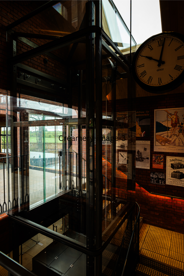 Hydraulic glass lift offers safe and accessible alternative to reaching the train-themed cafe from the platform at Castle Cary station, Somerset