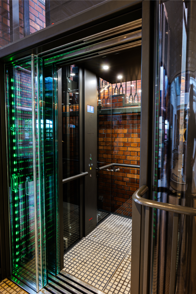 Natural light illuminates the interior and the car flooring matches the rest of the building