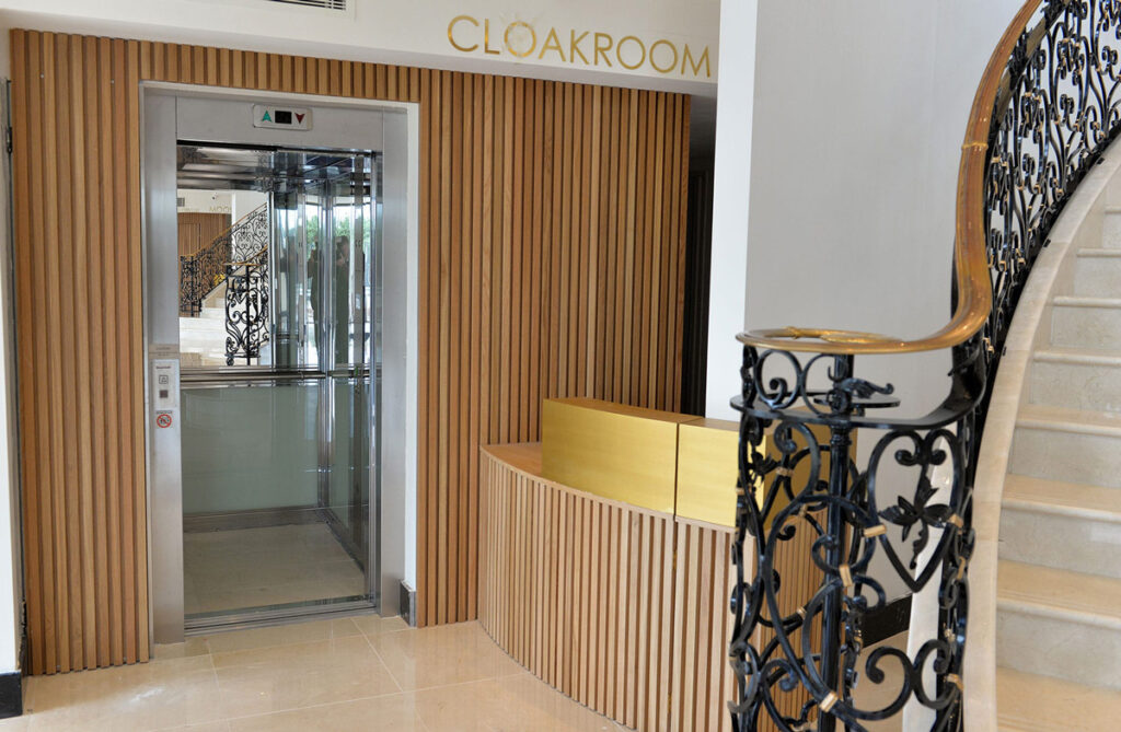 Glass passenger lift at Meridian Grand Hotel.