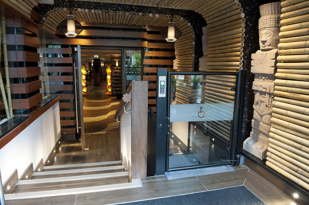 Lowriser with custom finish and glass entry doors.