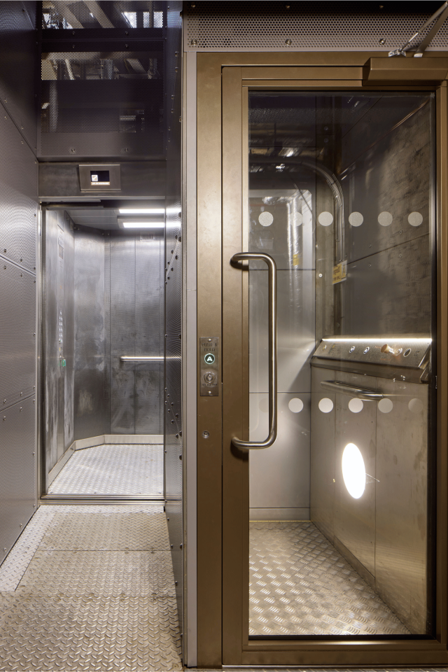 500kg hydraulic platform lift tucked neatly down a narrow corridor covers remaining travel distance