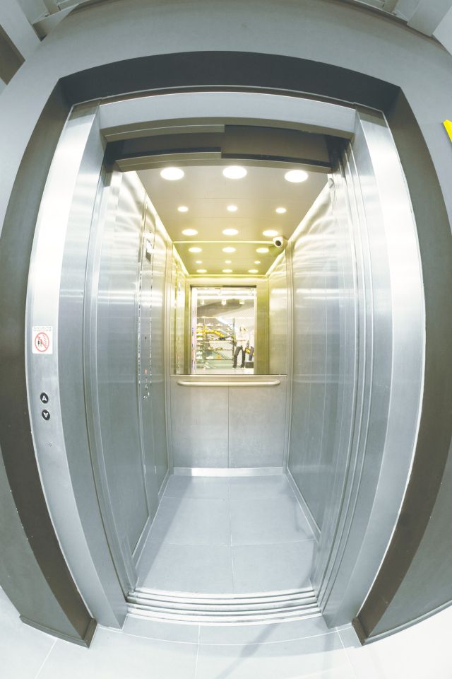 Satin stainless steel lift car interior: built to withstand daily wear and tear.