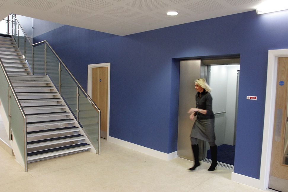 Finished in satin stainless steel with a white interior and blue carpeted floor: complements the school colours.