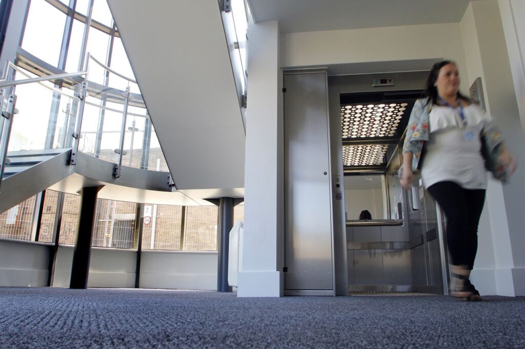 Exiting a passenger lift on the ground floor