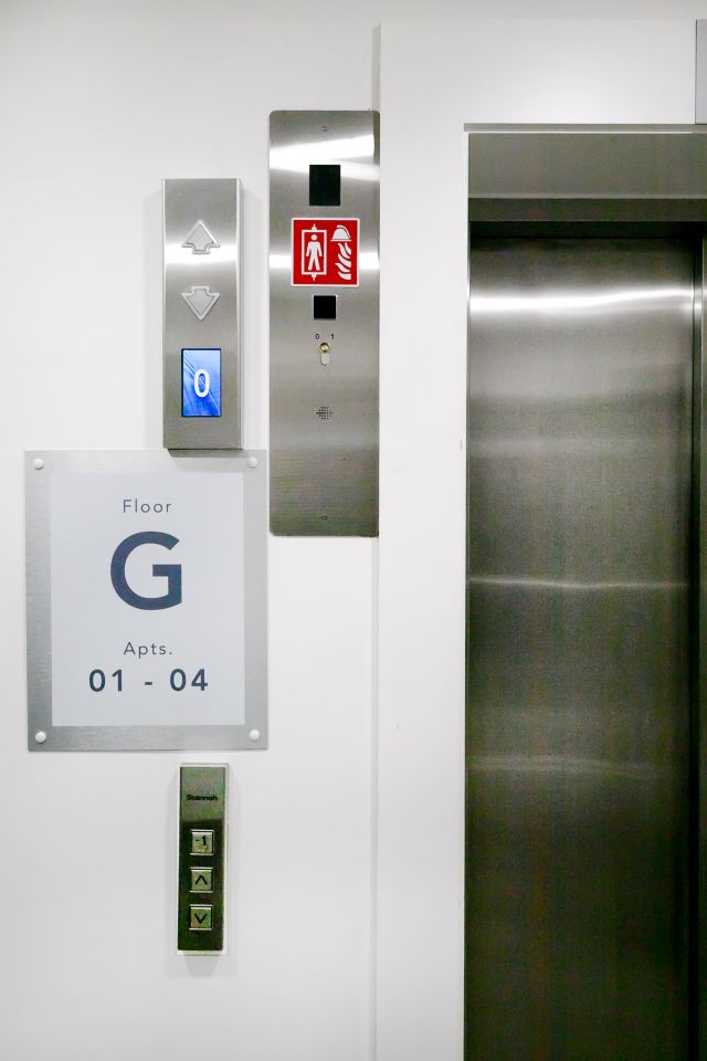 View of easily accessible, tactile landing call buttons and floor-level indicator