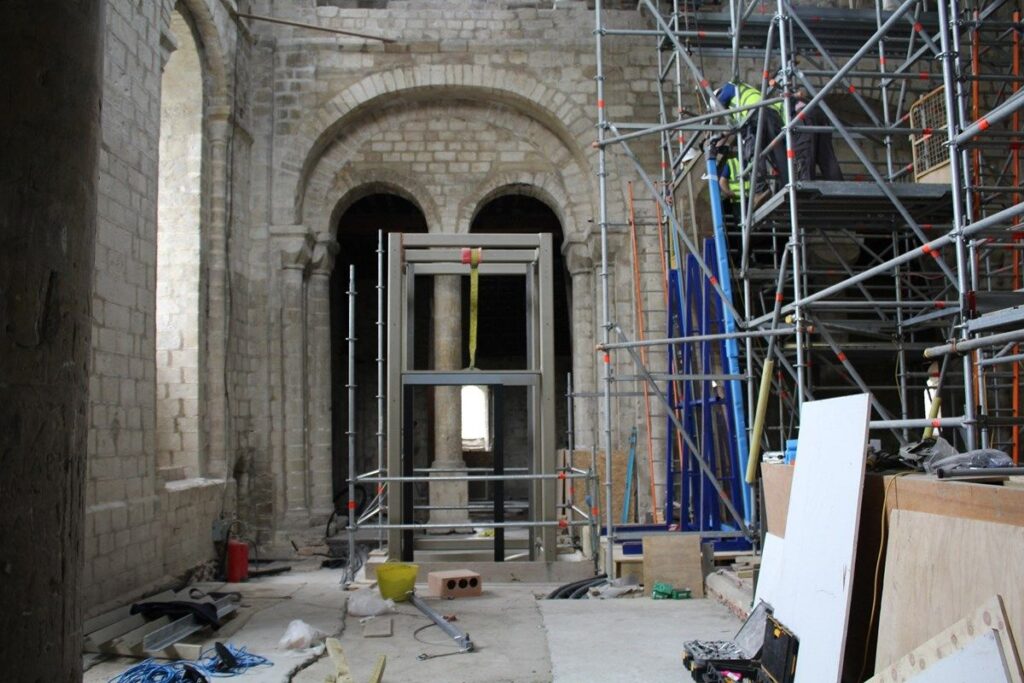 The frame of the bespoke passenger lift during installation. Image credit: Historic England