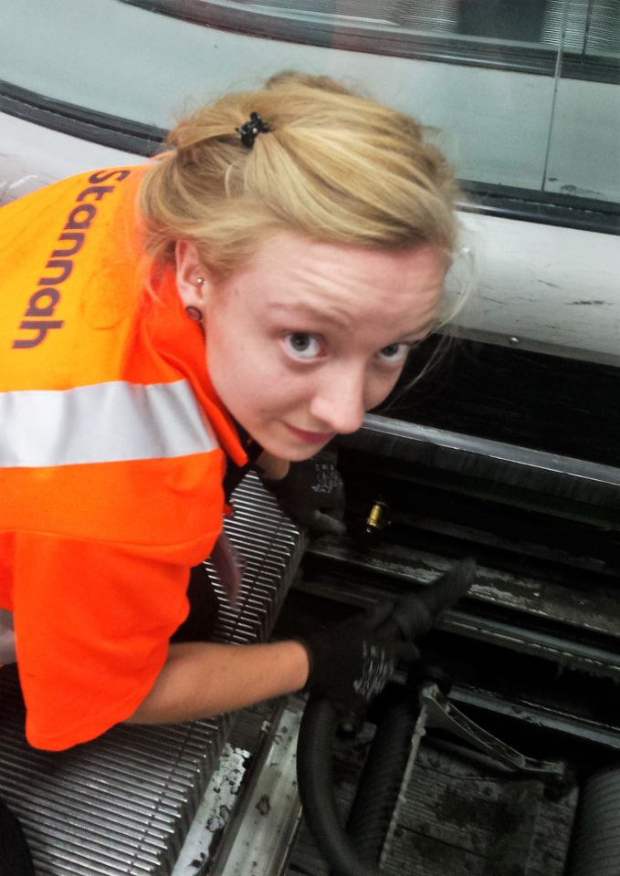 Stannah apprentice, Sophie, servicing an escalator